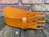Plain leather 38mm wide belt with 2 prong solid brass roller buckle. Choice of 13 colours