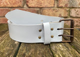 Plain leather 50mm wide belt with 2 prong dark brass look steel roller buckle. Choice of 13 colours