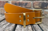 Plain leather 19mm-50mm wide belt with solid brass single roller buckle. Choice of 13 colours