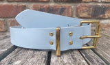 Plain leather 19mm-50mm wide belt with solid brass single roller buckle. Choice of 13 colours