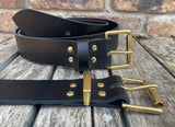 Plain leather 19mm-50mm wide belt with solid brass single roller buckle. Choice of 13 colours