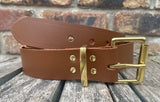 Plain leather 19mm-50mm wide belt with solid brass single roller buckle. Choice of 13 colours