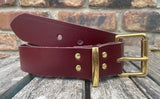 Plain leather 19mm-50mm wide belt with solid brass single roller buckle. Choice of 13 colours