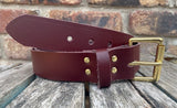 Plain leather 19mm-50mm wide belt with solid brass single roller buckle. Choice of 13 colours