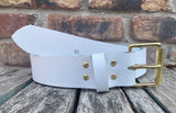 Plain leather 19mm-50mm wide belt with solid brass single roller buckle. Choice of 13 colours
