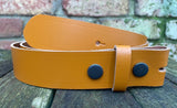Plain leather 19mm-50mm wide press stud/snap belt with black steel studs. Choice of 13 colours.