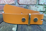 Plain leather 19mm-50mm wide press stud/snap belt with brass plated steel studs. Choice of 13 colours.