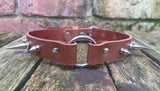 Spiked o-ring leather choker approx 19mm wide. Choice of 13 colours and spike size.
