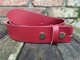 Plain leather 19mm-50mm wide press stud/snap belt with brass plated steel studs. Choice of 13 colours.