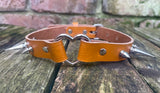 Spiked heart ring leather choker approx 19mm wide. Choice of 13 colours and spike size.