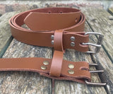 Plain leather 25mm wide belt with perforated steel or old brass roller buckle. Choice of 13 colours