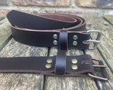 Plain leather 25mm wide belt with perforated steel or old brass roller buckle. Choice of 13 colours