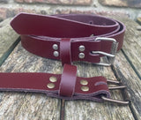 Plain leather 25mm wide belt with perforated steel or old brass roller buckle. Choice of 13 colours