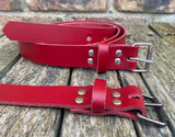 Plain leather 25mm wide belt with perforated steel or old brass roller buckle. Choice of 13 colours