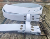 Plain leather 25mm wide belt with perforated steel or old brass roller buckle. Choice of 13 colours