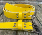 Plain leather 25mm wide belt with perforated steel or old brass roller buckle. Choice of 13 colours
