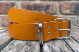 London tan plain leather belt with nickel plated steel roller buckle. Choice of width.