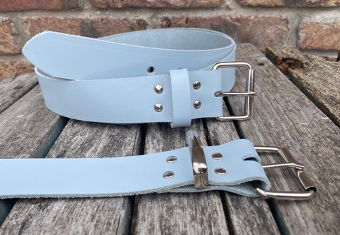 Baby blue plain leather belt with nickel plated steel roller buckle. Choice of width.