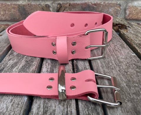 Pink plain leather belt with nickel plated steel roller buckle. Choice of width.