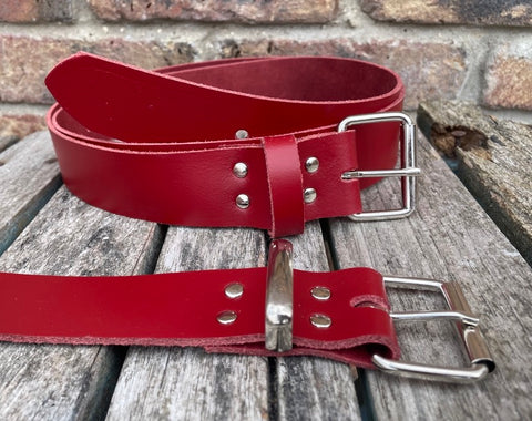 Red plain leather belt with nickel plated steel roller buckle. Choice of width.
