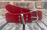 Red plain leather belt with nickel plated steel roller buckle. Choice of width.