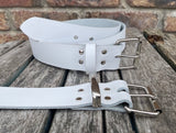 White plain leather belt with nickel plated steel roller buckle. Choice of width.