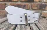 White plain leather belt with nickel plated steel roller buckle. Choice of width.