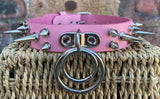 Double spiked D & o-ring leather choker approx 25mm wide. Choice of ring and spike size