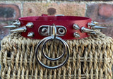 Double spiked D & o-ring leather choker approx 25mm wide. Choice of ring and spike size
